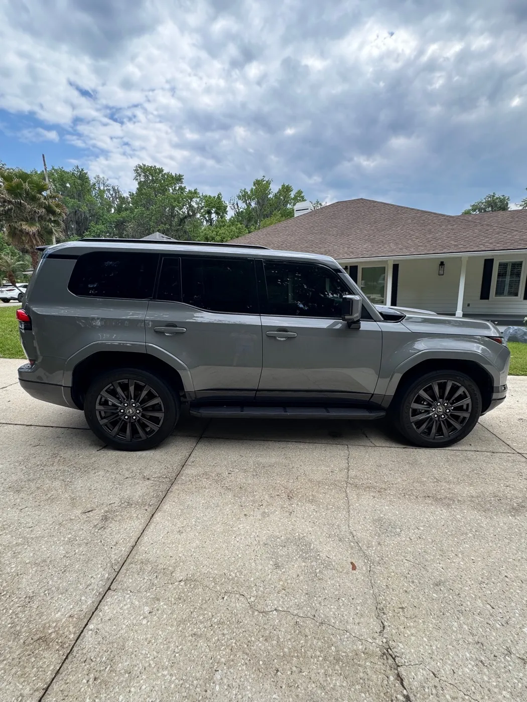 Gray Lexus GX parked in a driveway after a detail