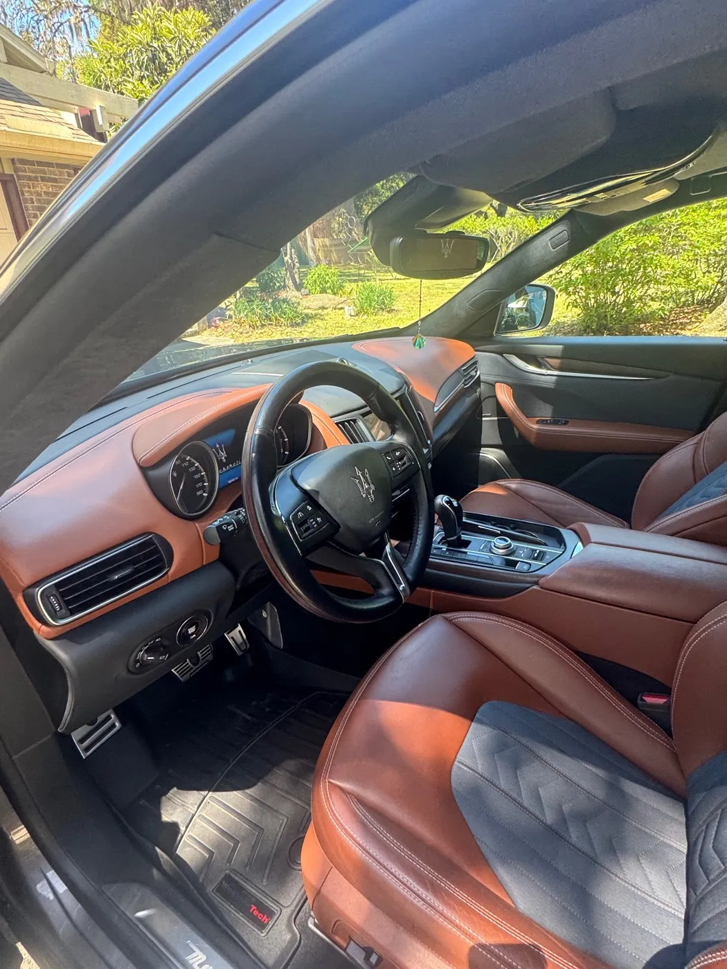 Maserati cabin with orange leather seats after a detail