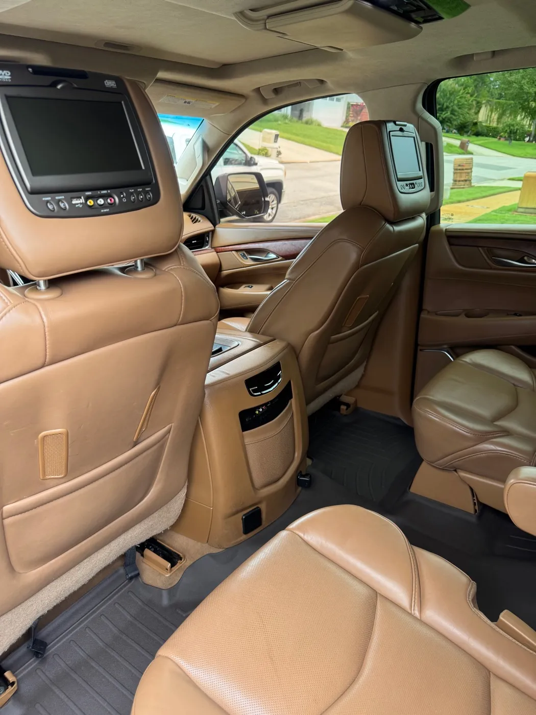 Cadillac Escalade front seats and dash in tan leather after a detail